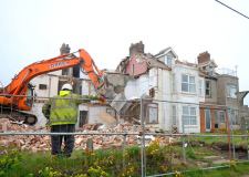 Antony Kelly's photo of Happisburgh houses being demolished.