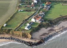erosion threatening remaining houses on cliff-top