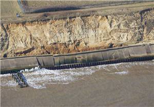 aerial view of the sea wall with collapsed sections