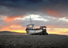 A fishing boat stands alone while the sun sets over Weybourne Beach. PHOTO: ANTONY KELLY