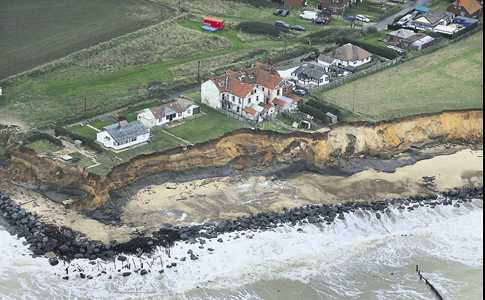 Aerial view of Happisburgh showing Jane's bungalow near to the cliff edge
