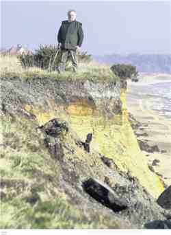 Peter Boggis standing on the crumbling cliffs