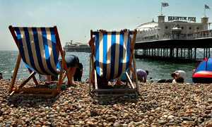 deckchairs on Brighton Beach looking out to the pier